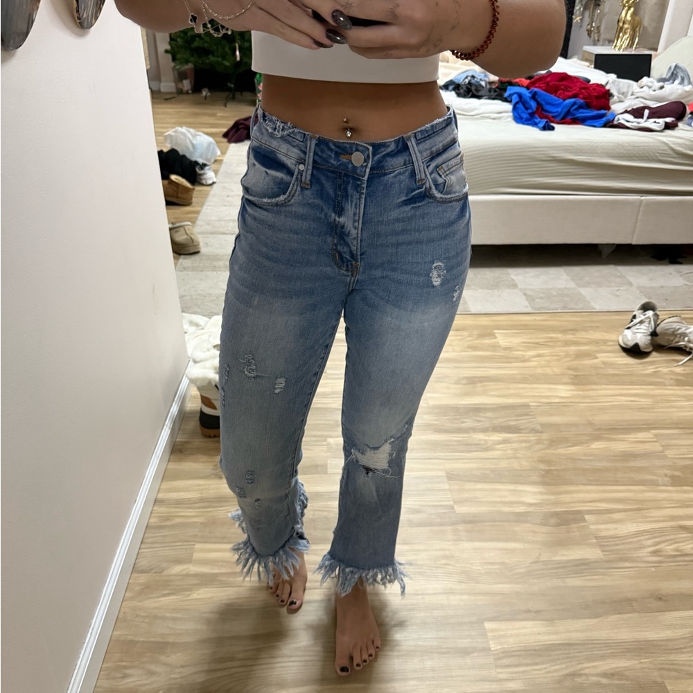 Distressed Blue Jeans with Frayed Hem
